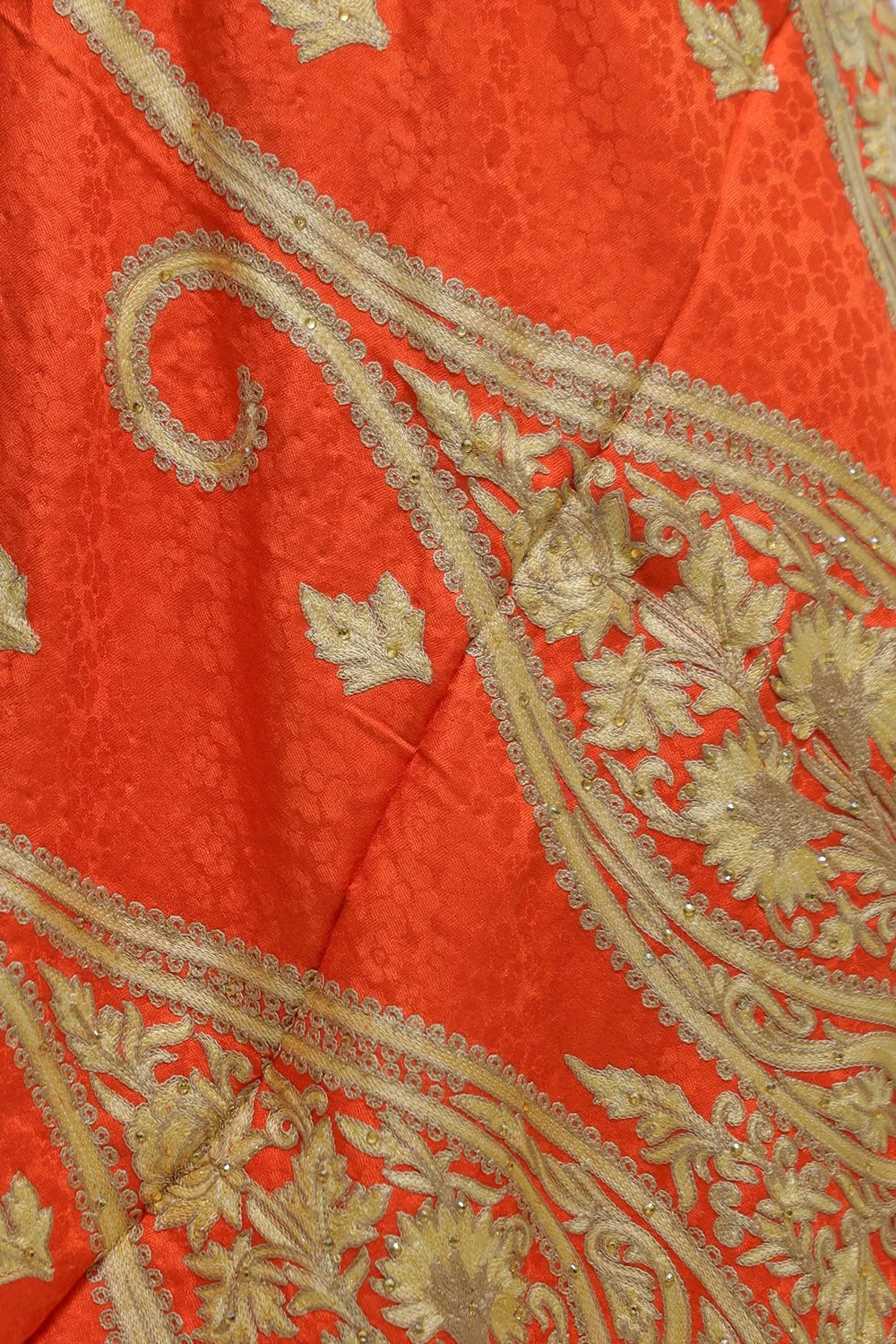Orange Colour Stole Enriched With Beautiful Aari Embroidery And A Touch Of Swarovski.